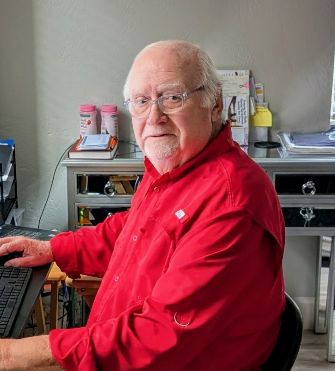 Ray Brewster, owner of Brewsters Bookkeeping, at his desk